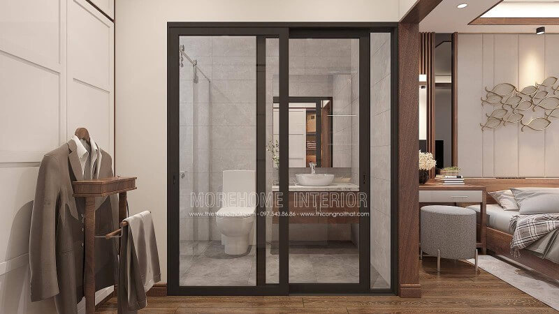 Bạn đang băn khoăn với ý tưởng thiết kế phòng ngủ nam khép kín khi sử dụng gỗ óc chó làm vật liệu chủ đạo phòng ngủ thì phòng tắm nên trang trí như nào cho hợp lý mà vẫn giữ nguyên vẻ đẹp sang trọng đó. Ý tưởng thiết kế phòng tắm cửa kính trượt viền đen kết hợp không gian màu xám từ gạch ốp giả bê tông cùng tủ đựng đồ phòng tắm bề mặt đá vân mây với lớp cánh gỗ óc chó sẽ là gợi ý khá độc đáo trong căn hộ chung cư, nhà phố, nhà liền kề, biệt thự. Thiết kế nội thất