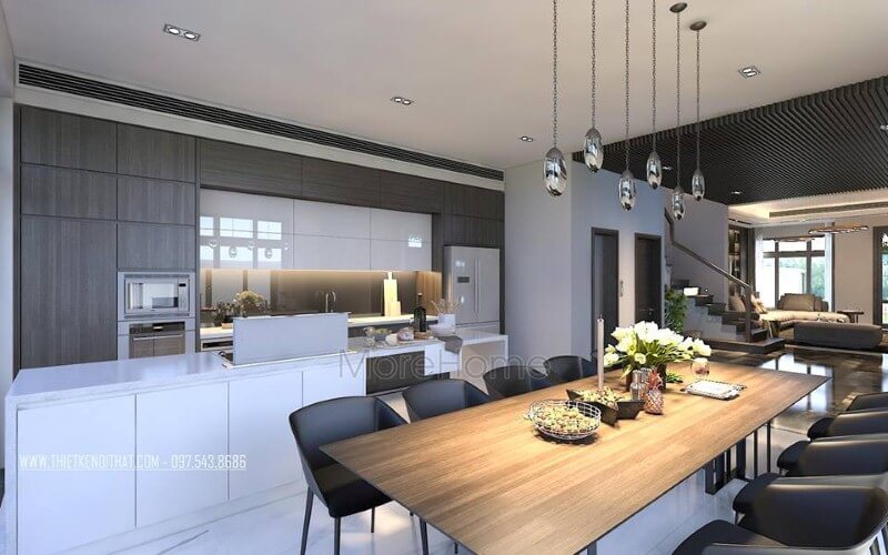 Trang trí nội thất phòng ăn liền bếp hiện đại, đẹp từ tủ bếp đảo kết hợp đá ốp cao cấp cùng bộ bàn ghế ăn gỗ nguyên tấm độc đáo. Thiết kế nội thất