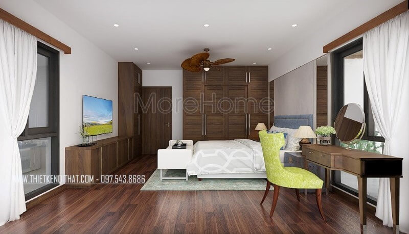 Sàn gỗ, bộ bàn ghế trang điểm, tủ quần áo, kệ tivi, cửa gỗ gỗ óc chó đã tạo nên vẻ đẹp sang trọng, độc đáo trong phong cách hiện đại tại phòng ngủ master mặc dù với phong cách này đồ nội thất gỗ công nghiệp thường là lựa chọn phổ biến. Thiết kế nội thất biệt thự tại Hà Nội