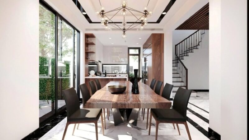 Ngoài ý tưởng thiết kế nội thất phòng ăn hiện đại cho biệt thự khi sử dụng đường nét vuông vắn từ khối gỗ lớn trong bàn gỗ óc chó, những chiếc ghế đồng bộ kiểu dáng thì việc bố trí thêm ánh sáng được cách điệu với ý tưởng như những đóa hoa lại tạo hiệu ứng tinh tế mang lại không gian sinh động cho một bữa tiệc thịnh soạn trong ý tưởng bố trí biệt thự Vinhomes Imperia Hải Phòng. Thiết kế nội thất