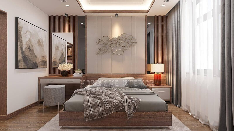 Bố trí phòng ngủ nam tính với những đường nét vuông vắn khỏe khoắn từ giường ngủ hiện đại, kệ trang trí đến các đường kẻ sọc trang trí mảng tường, hay ngay cả gương trang trí đều tạo nên vẻ đẹp cứng rắn độc đáo. Tuy nhiên những đường nét mềm mại làm điểm nhân từ hình ảnh đàn cá hay bức tranh canvas nghệ thuật sẽ là một gợi ý dung hòa ấn tượng thổi hồn trong phong cách sống chủ nhân. Thiết kế nội thất bệt thự Hà Nội